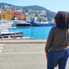 American woman over 40 looking at the port in France while considering moving abroad